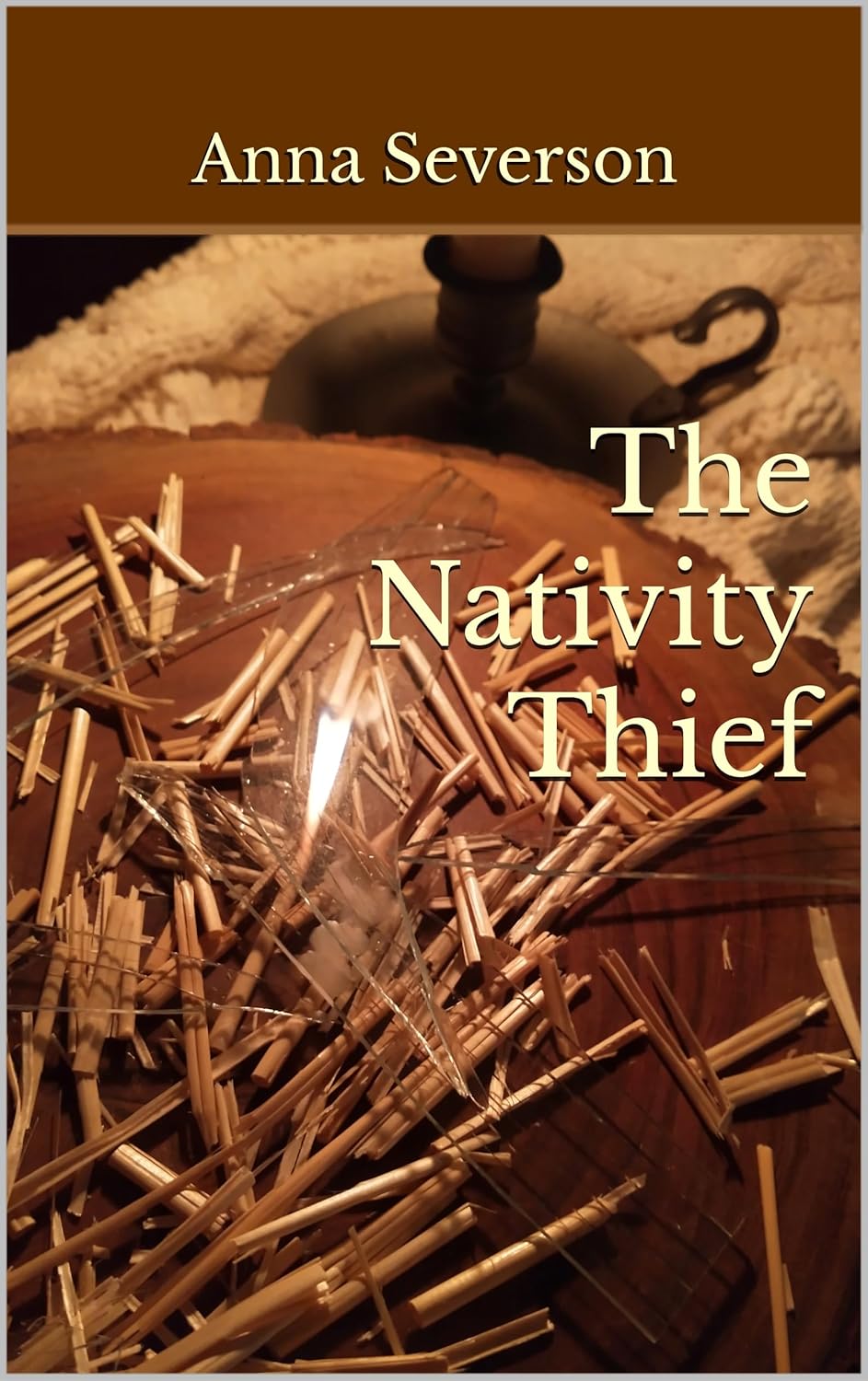 Book cover of 'The Nativity Thief' by Anna Severson with a nativity scene and gold stars.